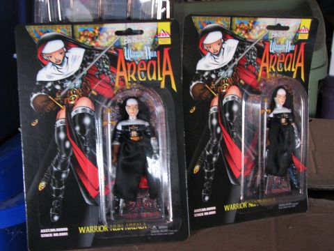 1991 Ford Bronco - Two Warrior Nun Areala action figures are displayed in their original packaging, suggesting they are collectibles.