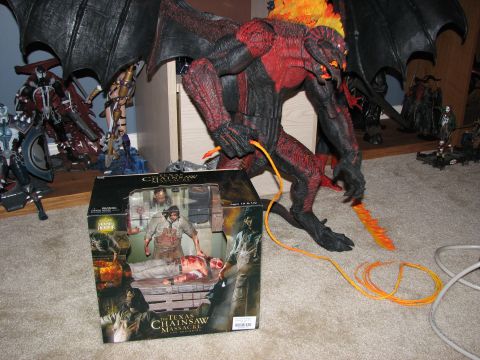 1991 Ford Bronco - Action figures and a large demon toy are displayed on a carpeted floor.