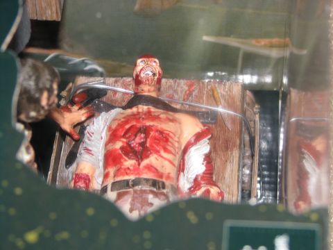 1991 Ford Bronco - A gory action figure is displayed in a diorama, with visible text at the bottom.