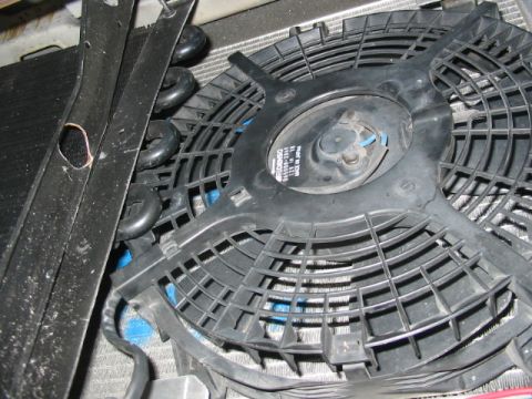 1985 Ford Crown Victoria LTD - A close-up view of a vehicle's radiator fan and surrounding components.