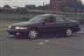 1993 Ford Taurus - This 1993 Ford Taurus is shown from the front three-quarter angle.