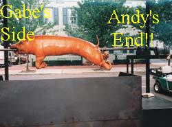 1993 Ford Taurus - A whole roasted pig is displayed on a spit, with text superimposed on the image.
