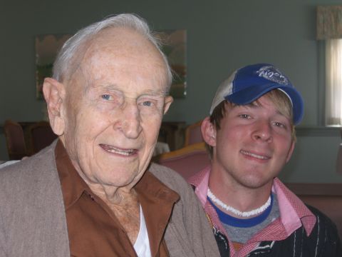 1994 Ford Bronco - An older gentleman and a younger man smile for a photograph, possibly at a family gathering or event.