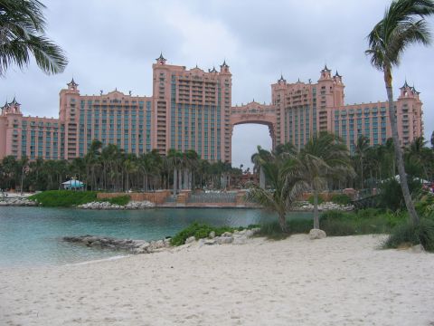 1994 Ford Bronco - The Atlantis resort on Paradise Island features a distinctive archway connecting its towers, surrounded by tropical foliage and a beach.