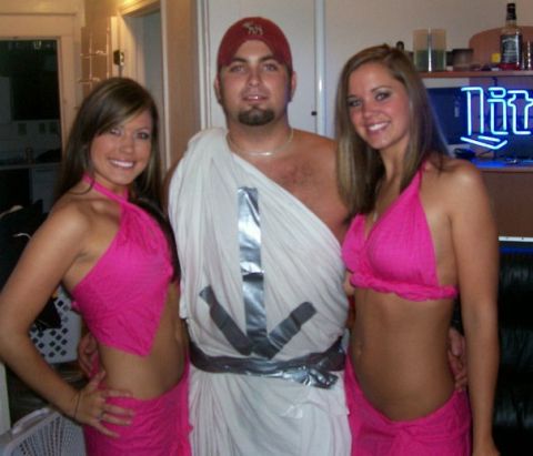 1994 Ford Bronco - A man and two women pose for a photo indoors, dressed in costumes.