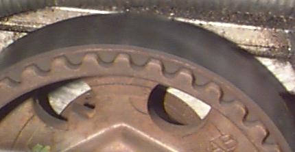 1993 Ford Taurus - A close-up view of a toothed gear, likely part of an engine's timing system.
