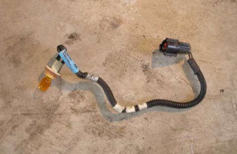 2001 Ford Crown Victoria - The passenger side corner lamp harness, consisting of a brown wire and a black ground wire. It is the ground wire that needs to be cut and…