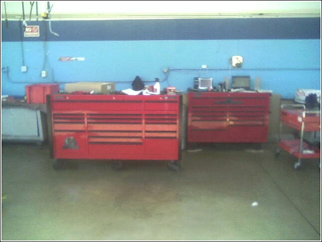 Red tool chests in a workshop with blue walls
