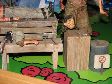 1991 Ford Bronco - A gruesome scene is depicted in this horror-themed diorama, complete with a chainsaw and various tools.