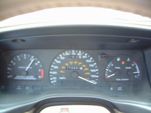 1993 Ford Taurus - Interior view of a 1993 Ford Taurus dashboard, showing the speedometer and other gauges.