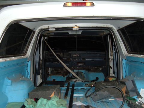 1993 Ford Bronco - Interior view of a 1993 Ford Bronco showing a roll cage and removed seats.