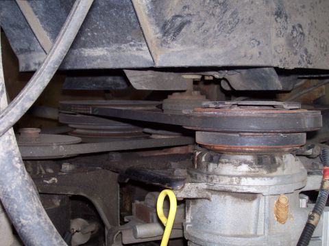 1985 Ford Bronco - The serpentine belt system on a vehicle's engine is shown in this close-up view.