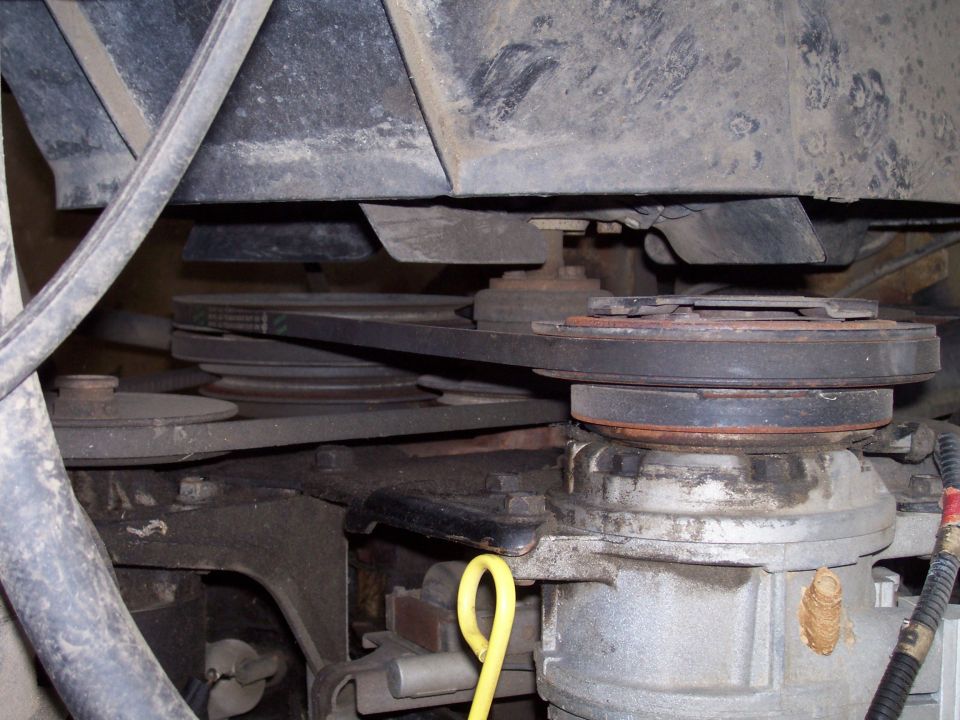 close-up of engine belts and pulleys