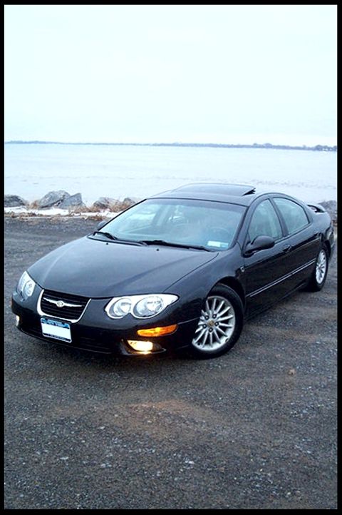 1999 Chrysler 300M - Black 1999 Chrysler 300M sits by the water on an overcast day.