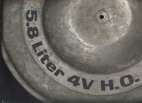 1979 Ford Bronco - Close-up of an engine part showing "5.8 Liter 4V H.O." text.