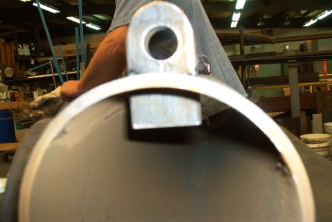 1983 Ford Bronco - Metal pipe with a bracket, likely part of a larger assembly or custom fabrication.