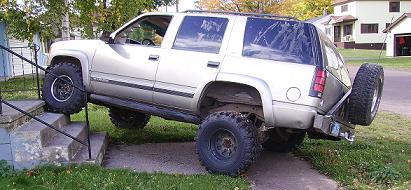 2000 Chevrolet Tahoe - This modified Chevrolet Tahoe is attempting to ascend a set of stairs, its off-road capabilities.