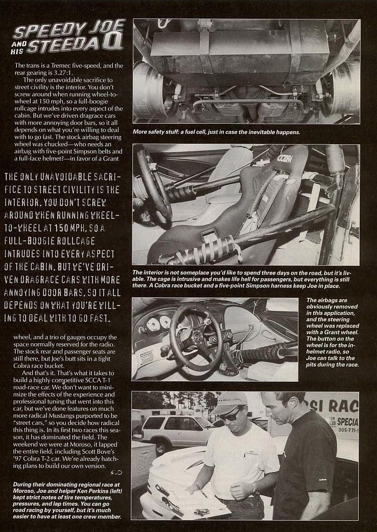 Interior of a 1997 Cobra T-2 race car with roll cage, racing seat, and Grant steering wheel
