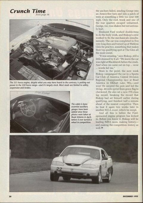 1995 Ford Mustang - A 1995 Ford Mustang is captured in action on the race track, displaying its racing livery and number.