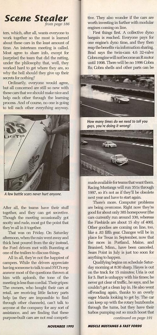 Several race cars on a track, one with smoke coming from its tires