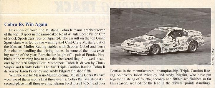 1995 Ford Mustang Cobra R race car with sponsor decals on a track