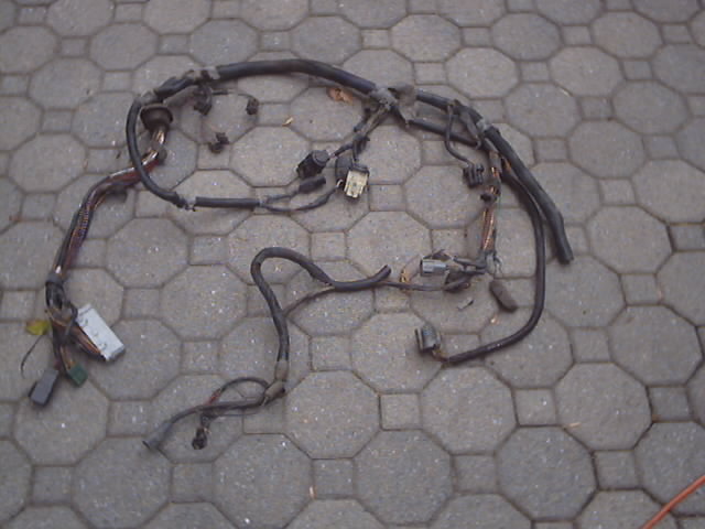 Wiring harness laid out on a paved surface