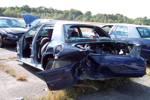 1991 Ford LTD Crown Victoria - This heavily damaged Ford Crown Victoria appears to have sustained significant rear-end collision damage.