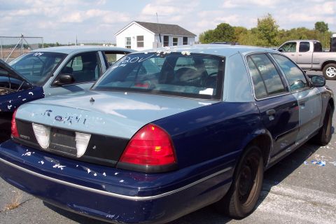 1991 Ford LTD Crown Victoria - This 1991 Ford Crown Victoria LTD is seen from the rear in a two-tone blue and light blue paint scheme.
