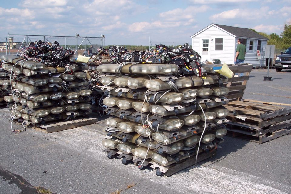 Stacks of police light bars on pallets