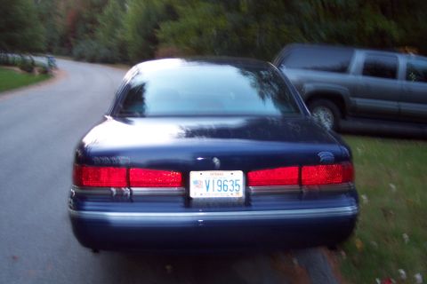 1991 Ford LTD Crown Victoria - Rear view of a 1991 Ford Crown Victoria LTD, showing its taillights and license plate V19635.