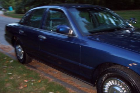 1991 Ford LTD Crown Victoria - This sedan's body style suggests it is from the early 1990s, but it is not a 1991 Ford Crown Victoria LTD.