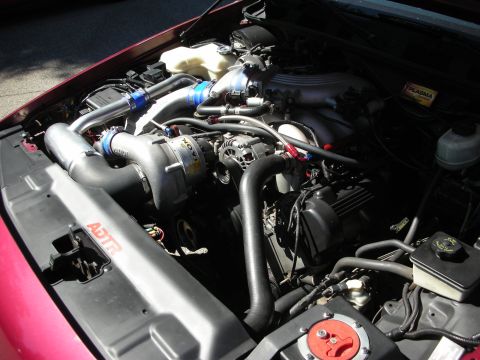 1992 Ford Crown Victoria - Customized engine bay a supercharger and intercooler piping, with an ADTR logo on the fender liner.