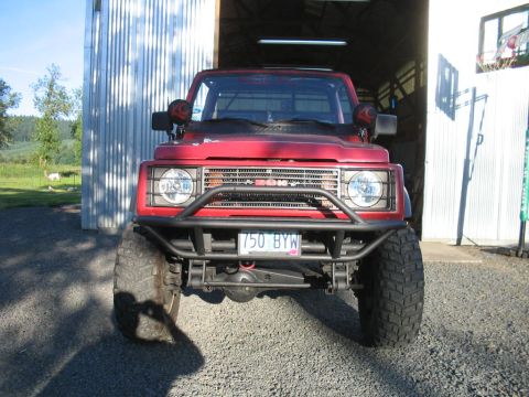 1987 Suzuki Samurai - This Suzuki Samurai is ready for adventure with its lifted suspension and aggressive tires.