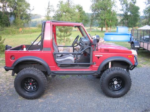 1987 Suzuki Samurai - This Suzuki Samurai has been modified with a roll cage and larger tires for off-road use.