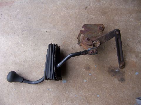 1987 Ford Bronco - This is a vehicle shift lever assembly, likely for a manual transmission, shown with its rubber boot and linkage.