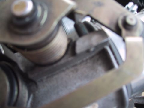 1994 Ford Bronco - This is a close-up view of a vehicle's throttle body assembly, showing mechanical components.