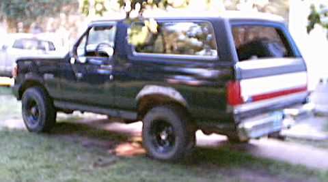 1989 Ford Bronco - Rims, tailgate, front bumper and lower foot of body painted dark gray. 9-1-02