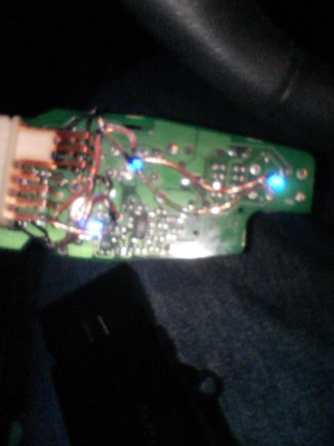 2000 Dodge Durango - A close-up view of a circuit board several small blue LEDs and exposed copper wiring.