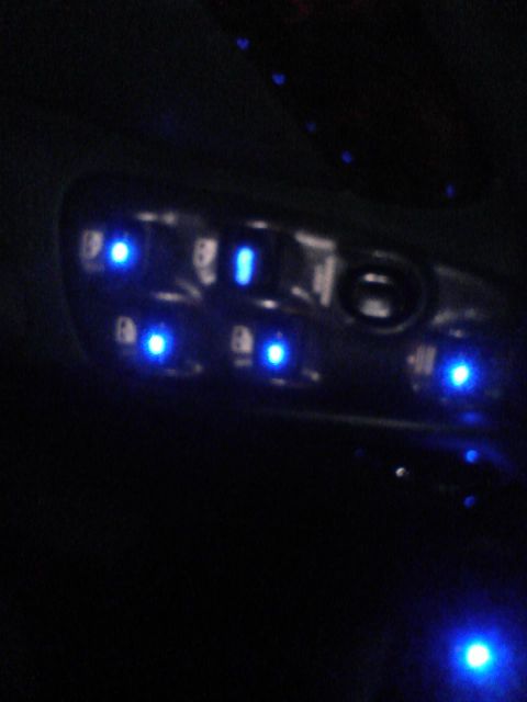 2000 Dodge Durango - Interior door panel with blue LED lights illuminating window and lock controls.