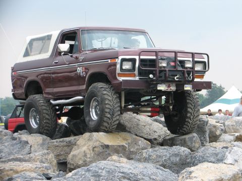 1992 Ford Bronco - This lifted Bronco navigates a rocky obstacle course, its off-road capabilities with a soft top and front bull bar.