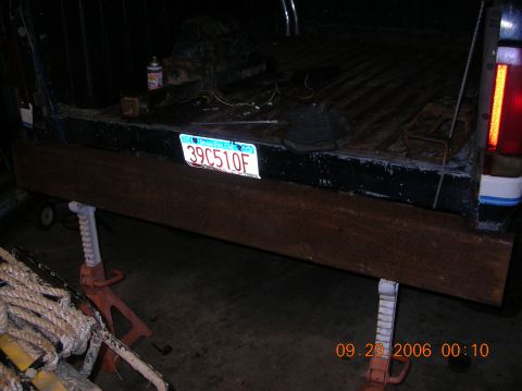 1991 Ford F-150 - Rear view of a 1991 Ford F-150 pickup truck, showing the tailgate and license plate.