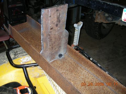 1991 Ford F-150 - A close-up view of a heavily rusted metal component, possibly a custom fabrication, with a date stamp visible.