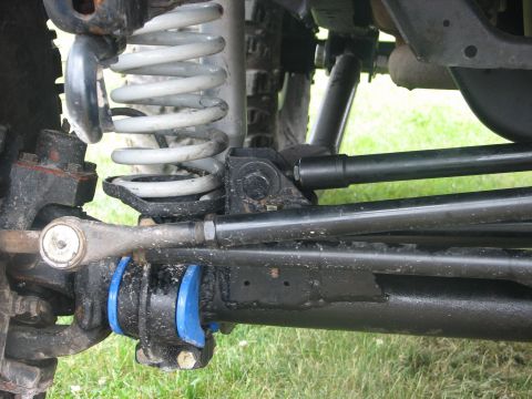 1992 Ford Bronco - Detailed view of the undercarriage suspension system of an off-road vehicle.