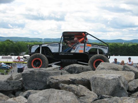 1992 Ford Bronco - Custom off-road buggy with roll cage navigates a rocky obstacle course.