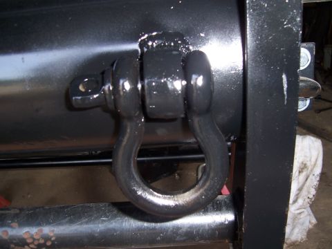1983 Ford Bronco - Shackle attached to a black surface, with Supermotors website text visible.