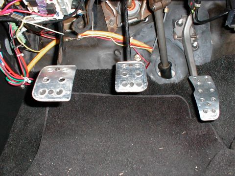 1993 Ford Thunderbird - The interior footwell shows three pedals and a complex wiring harness, suggesting a manual transmission.