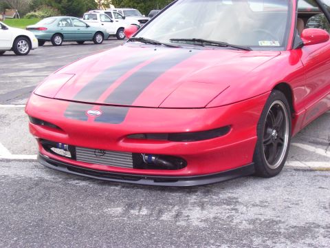 1997 Ford Probe - Front view of a modified 1997 Ford Probe with racing stripes and an exposed intercooler.