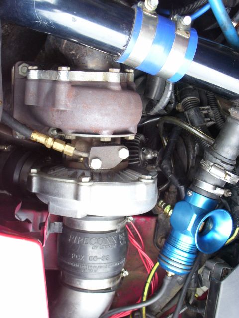 1997 Ford Probe - This image shows a turbocharger and associated piping, not a 1997 Ford Probe.