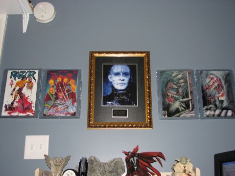 1991 Ford Bronco - A framed portrait of Pinhead from Hellraiser, signed by the actor, hangs on the wall.