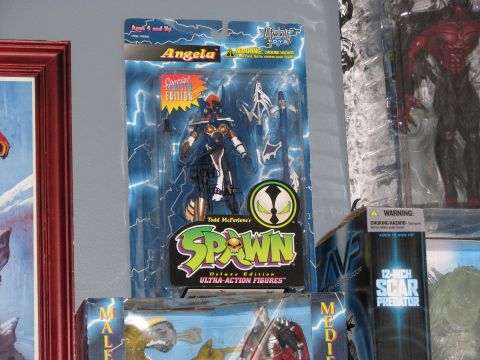1991 Ford Bronco - A Spawn action figure is displayed in its packaging, alongside other collectible toys.